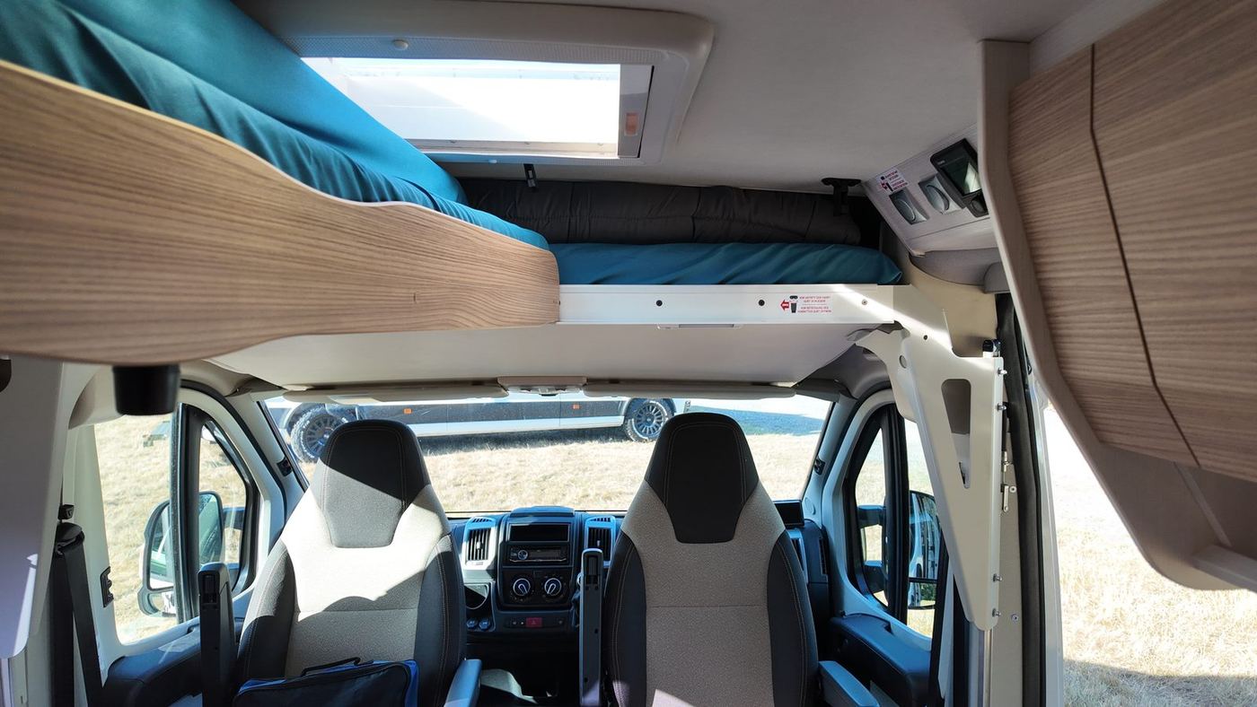 KNAUS campervan: drop-down double bed lowered over the cab